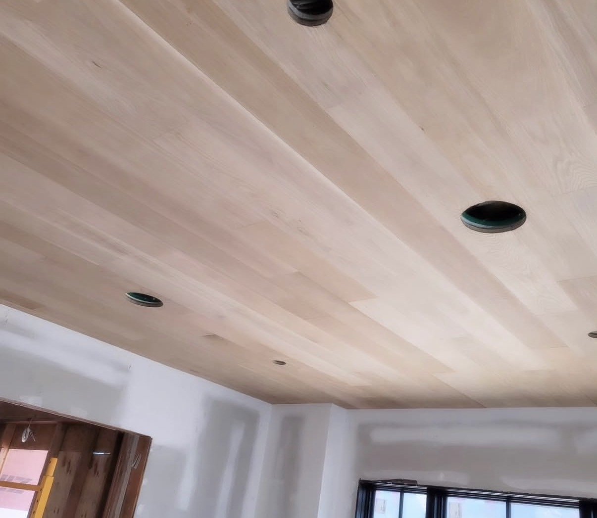 Custom solid wood ceiling with recessed light cutouts