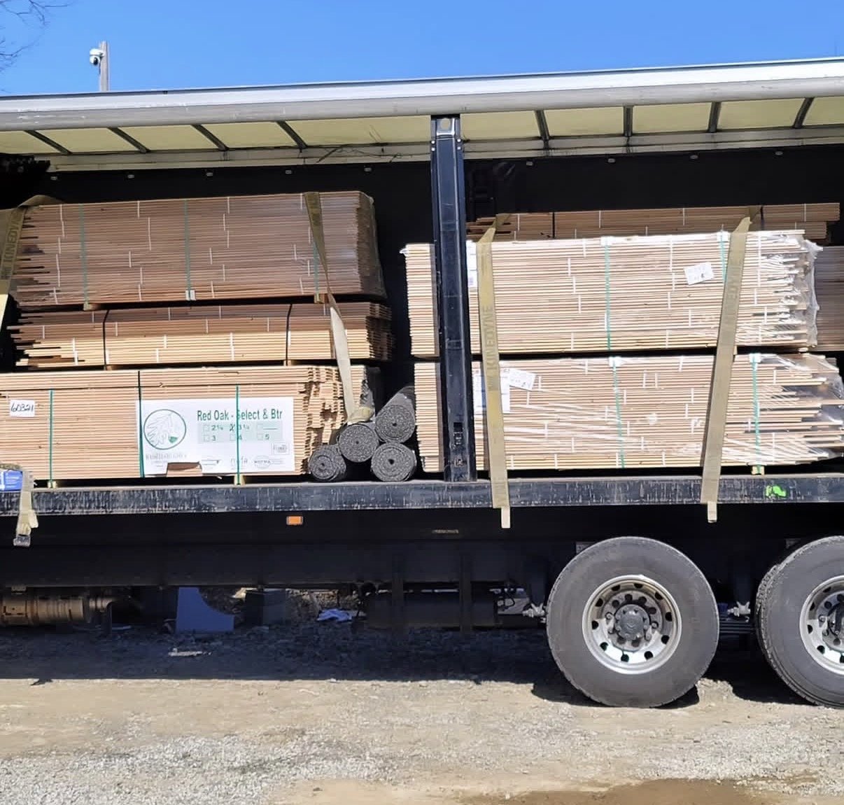 Delivery truck loaded with Red Oak Select and Better flooring bundles