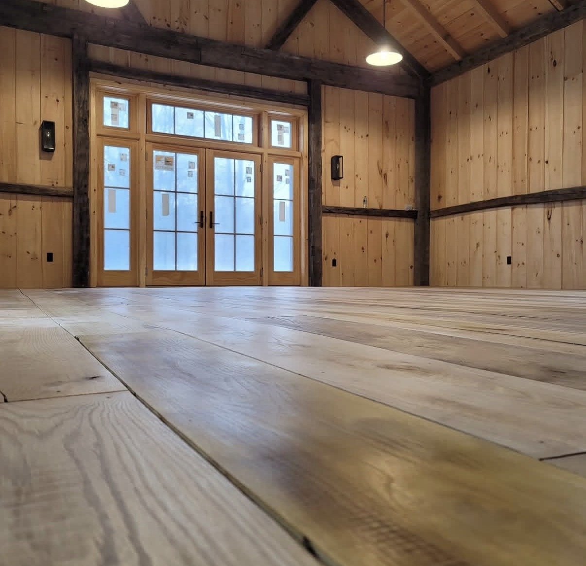 Low-angle view of a wide-plank floor sanded on site